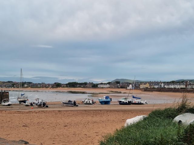 Small boats moored on sand near Elie harbour